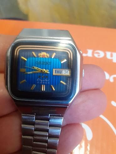 swatch saati: Qol saatı, Orient, rəng - Gümüşü — 1