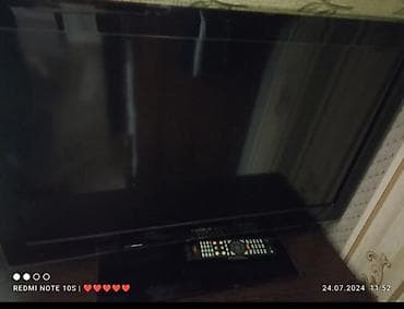 tlvzor: LCD/LED televizor, stolüstü dayaqlı, uzaqdan idarəetmə pultu ilə. - — 2