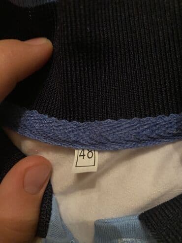 Kia: Ağ rəngli qısaqoll polo köynək. - Ölçü: 48 (etiketdə göstərilib) - — 2