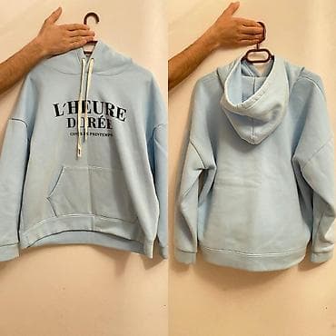 Açıq mavi rəngli kapüşonlu svitşört. - Ön hissədə “L’HEURE DORÉE –