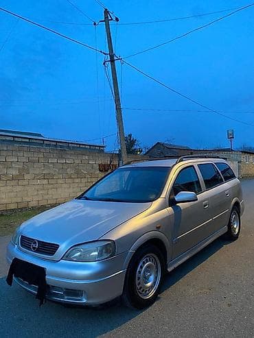 turbo az gazel: Opel Astra Caravan (universaI) – gümüşü rəng Xüsusiyyətlər: - Kuzov — 5