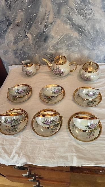 чайный сервис: Çay sevizi. 6- nəlbəki, 6- fincan, 1- çaynik, 1- süd qabı, 1- şəkər — 5
