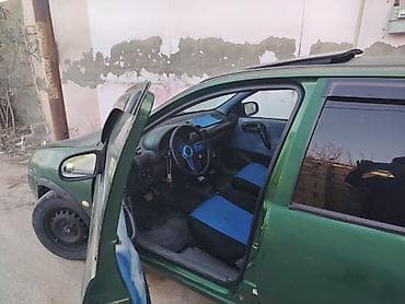 opel karopka: Opel Corsa B, yaşıl rəng, hetçbek gövdə. Texniki xüsusiyyətlər: - — 3