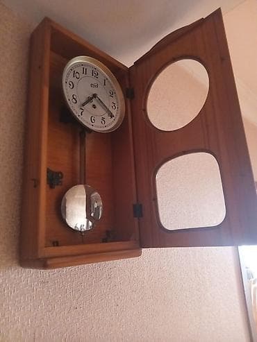 Divar saatları, Mexaniki, Mayatnik