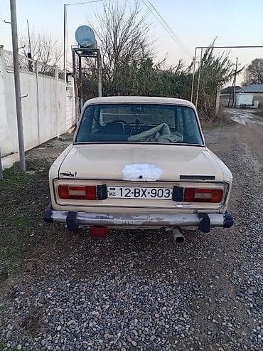 VAZ 2106 sedan Xüsusiyyətlər: - Kuzov: 4 qapılı sedan, bej rəng -