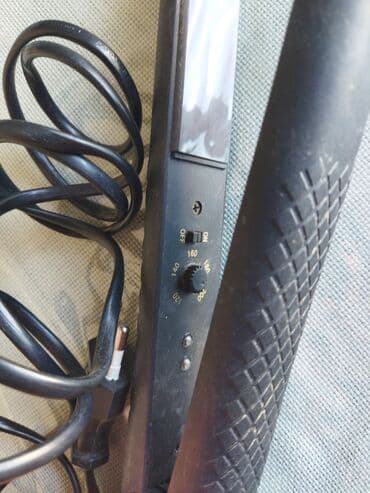 dyson airwrap baku electronics: Qara rəngli saç düzləşdiricisi saça istiliklə düz forma vermək üçün — 1