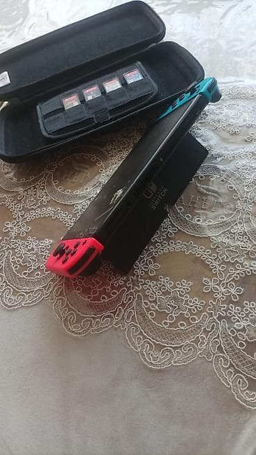 Nintendo Switch: Satılır Nintendo Switch konsol set: Nintendo Switch Konsol + 4 Oyun + — 3