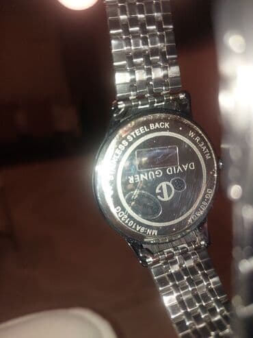 brilyant qaşlı üzük metni: David Guner kişi qol saatı - Korpus: dairəvi, qara rəngli. - — 3