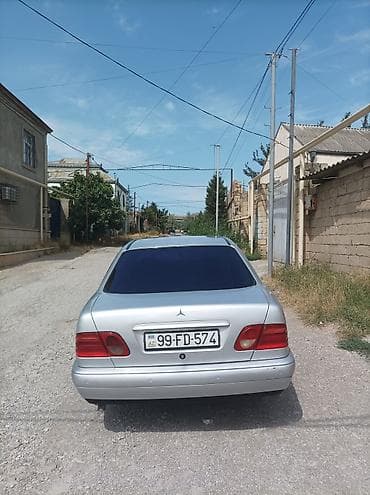 vaz lada oka: Mercedes-Benz E‑Class (W210) sedan – gümüş rəng. 1998 çi il 2.2 — 4
