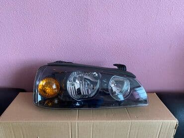 on fara: Hyundai Elantra 2004 on faralari . Hyundai Elantra 2005 qabaq sag ( — 1