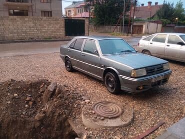 işlənmiş radiatorlar: Model: Tofaş Şahin/Doğan (sedan) Kuzov: 4 qapılı, boz rəng Nömrə: AZ — 3