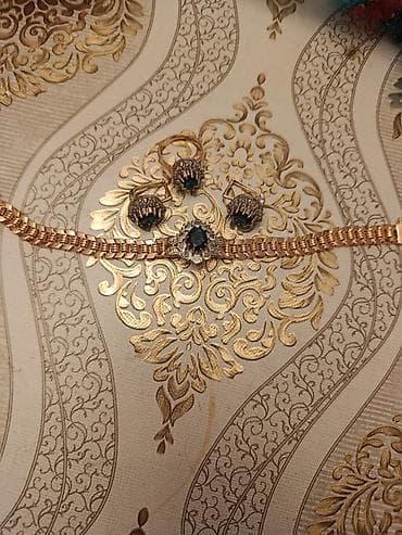 Zərgərlik dəsti – qızılı tonlarda metal əsaslı - İncə işləməli qolbaq lalafo.az -da Zərgərlik dəsti – qızılı tonlarda metal əsaslı - İncə işləməli qolbaq