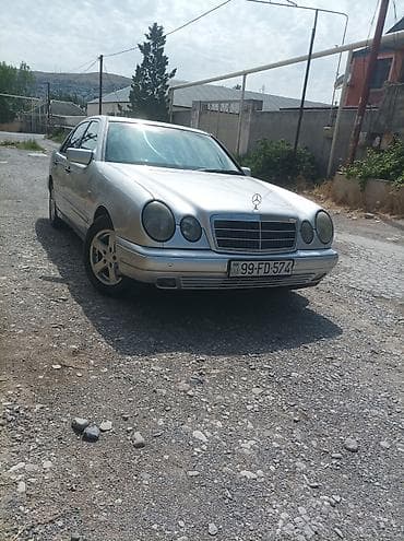 vaz lada oka: Mercedes-Benz E‑Class (W210) sedan – gümüş rəng. 1998 çi il 2.2 — 2