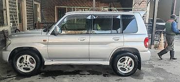 lider diskleri: Mitsubishi Pajero ıo 2002 1.8 (5 qapı) – gümüş rəngdə kompakt — 3