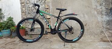 электро велик: Yaşıl və qara rənglərdə olan bu dağ velosipedi, sürət dəyişdiriciləri — 1