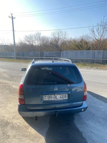 oka satılır: Model: Opel Astra Caravan (universal kuzov) Rəng: tünd boz Yanacaq — 11