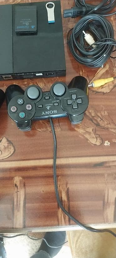 plesteşın 2: Se) Paketə daxildir: - PS2 Slim konsolu - 2 ədəd simli DualShock 2 — 5