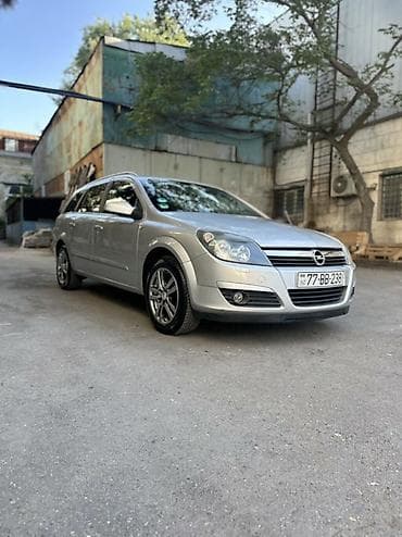 Opel Astra H Caravan (universal), gümüşü rəng. - Kuzov: 5 qapılı