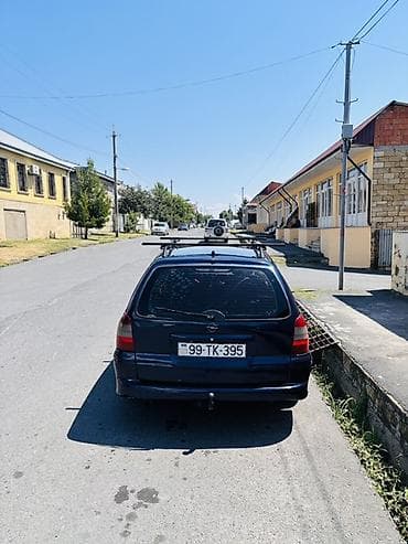 46 kuza: Opel Vectra Caravan (Universal), tünd mavi rəng. Xüsusiyyətlər: - — 3