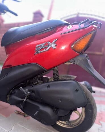 w202 dönmə işığı: Qırmızı rəngdə ZX skuter Məlumat: - Kompakt və yüngül kuzov, şəhər — 3