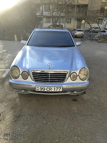 Mercedes-Benz E-Class (W210), gümüş rəng. Xarici: - Klassik W210