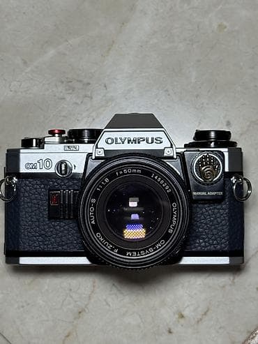 instax mini 12 en ucuz: 1979-cu il Yaponiya istehsalı. Olympus OM 10 35 mm film ilə işləyən — 1
