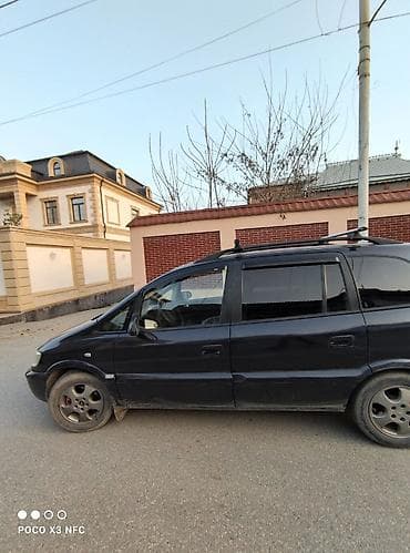 запчасти форд фокус 1: Opel Zafira A, qara rəng, 7 yerlik miniven. Xüsusiyyətlər: - Geniş — 1