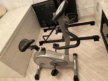 trenajor velosiped: Gümüşü rəngdə, yığcam ölçülü velotrenajor. Üzərində məlumatları əks — 2