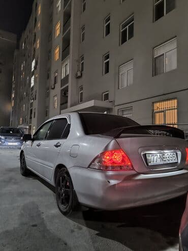 e 124: Mitsubishi Lancer: 1.6 l | 2006 il 34000 km Sedan — 7