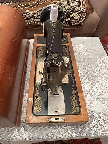 Mexaniki tikiş maşını – stolüstü, qoldan fırladılan model