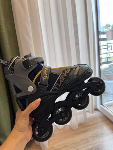 TİANE markalı, qara, boz və sarı rənglərdə olan bu rolik konki modeli