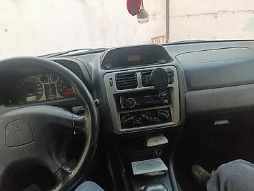 Mitsubishi: Mitsubishi Pajero iO (5 qapı) SUV - Kuzov: ağ/gümüş iki rəngli, yan — 5