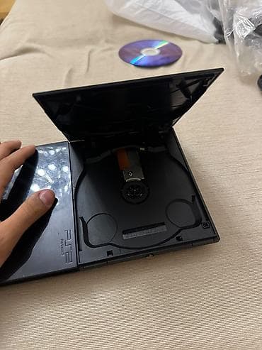 ps1 disk: PlayStation 2 Slim oyun konsolu. Kompakt və nazik korpusa malik PS2 — 5