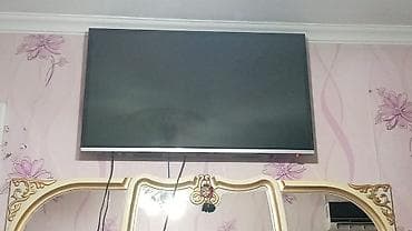 Divar asılqanlı LED televizor.Towibo markasidi ve 110 ekrandi. -