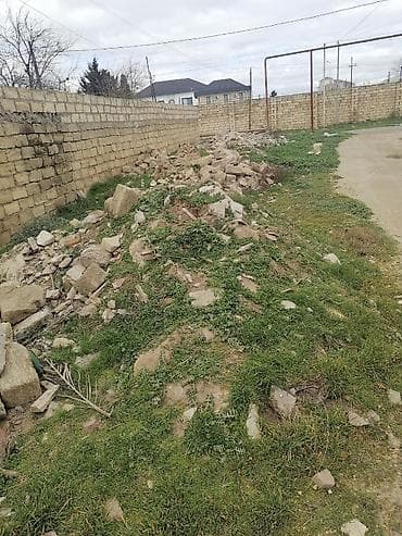 parca: Məhlədə yığılmış tikinti qırıntıları və daş-çınqıl materialı. Tərkib — 3