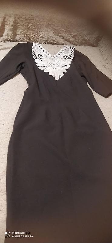 Qara rəngli zərif qadın donu - Model: Dizə yaxın uzunluqda klassik