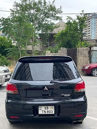 07 disk: Mitsubishi Airtrek (Black) – şəhər və uzun yol üçün çox yönlü kompakt — 3