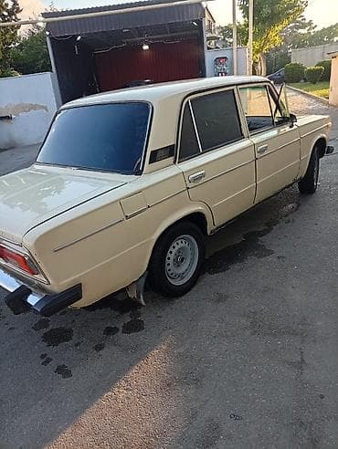 Nəqliyyat: VAZ 2106 sedan - Korpus: 4 qapılı, bej/ağ rəng, xrom bamperlər — 4