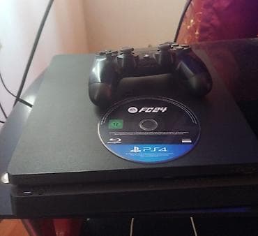 15 pro max titanium: Sony PlayStation 4 konsolu, DualShock 4 nəzarət cihazı və "FC24" oyunu — 1