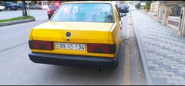 gəncə avtomobil zavodu: Sarı rəngli sedan avtomobil Xüsusiyyətlər: - Kuzov: 4 qapılı sedan — 6