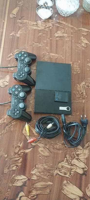 plesteşın 2: Se) Paketə daxildir: - PS2 Slim konsolu - 2 ədəd simli DualShock 2 — 1
