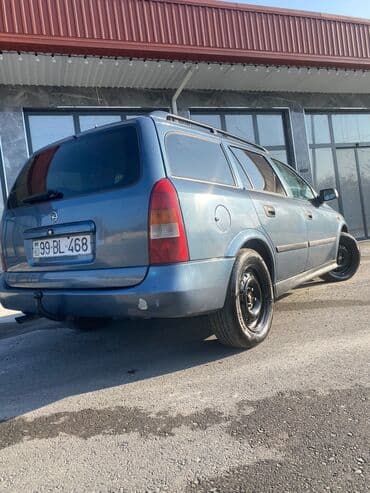 oka satılır: Model: Opel Astra Caravan (universal kuzov) Rəng: tünd boz Yanacaq — 10