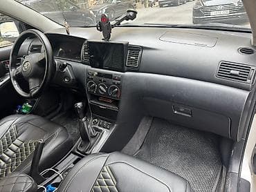 Toyota Corolla hatchback (E120). Gümüşü rəng, 5 qapı, 5 nəfərlik — 9