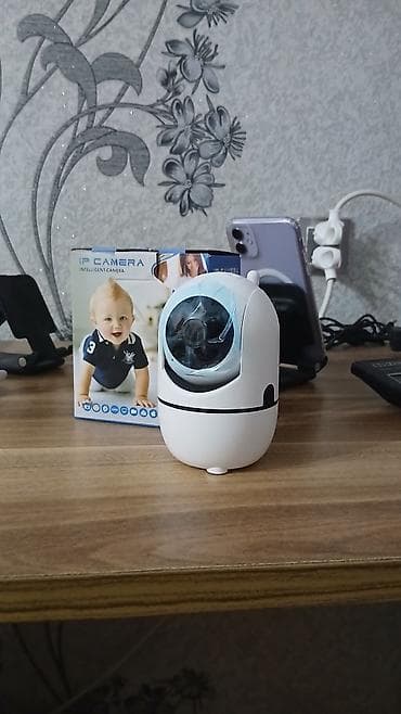 Şəkildəki cihaz ağıllı IP təhlükəsizlik kamerasıdır (çox vaxt "Video — 4