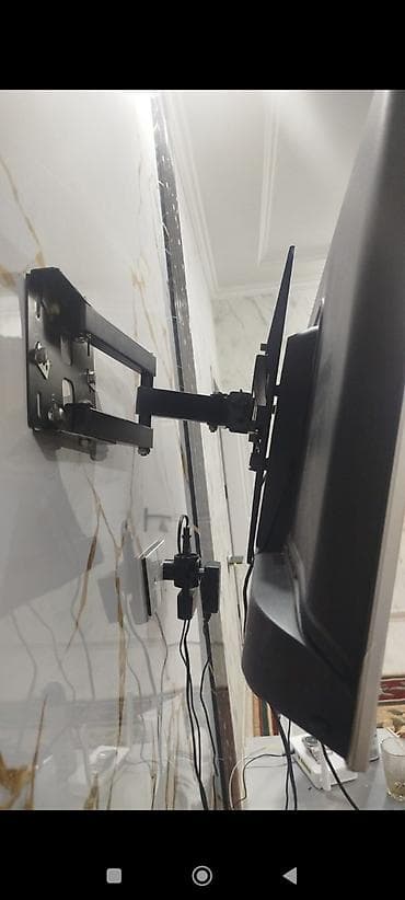 taube tv: Döndərilə bilən divar asqısı ilə LCD/LED televizor - Müxtəlif ölçülü — 1