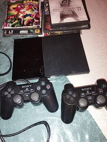 Sony PlayStation 2 Slim komplekti Tərkib: - PS2 Slim (qara) - 2 ədəd — 2
