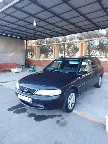 07 salon: Opel Astra Caravan (universall) – qara rəng Xüsusiyyətlər: - Kuzov — 1