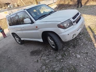 vossen diskleri: Mitsubishi Pajero iO GDI, ağ rəngdə kompakt off-road SUV — 1