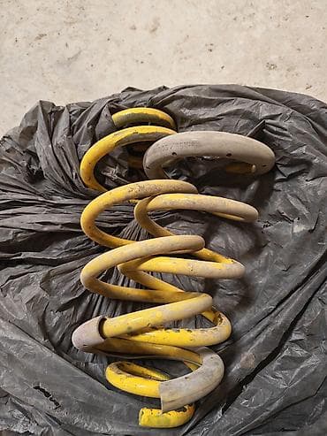 spiral yay: Məhsul: Avtomobil üçün sarı rəngli sərtləşdirilmiş asqı yayları (cüt) — 2