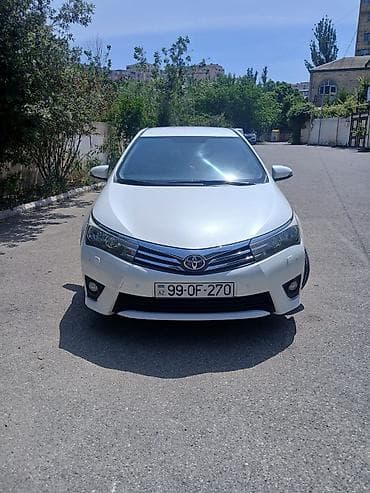 Toyota Corolla: 1.6 l | 2014 il Sedan — 1